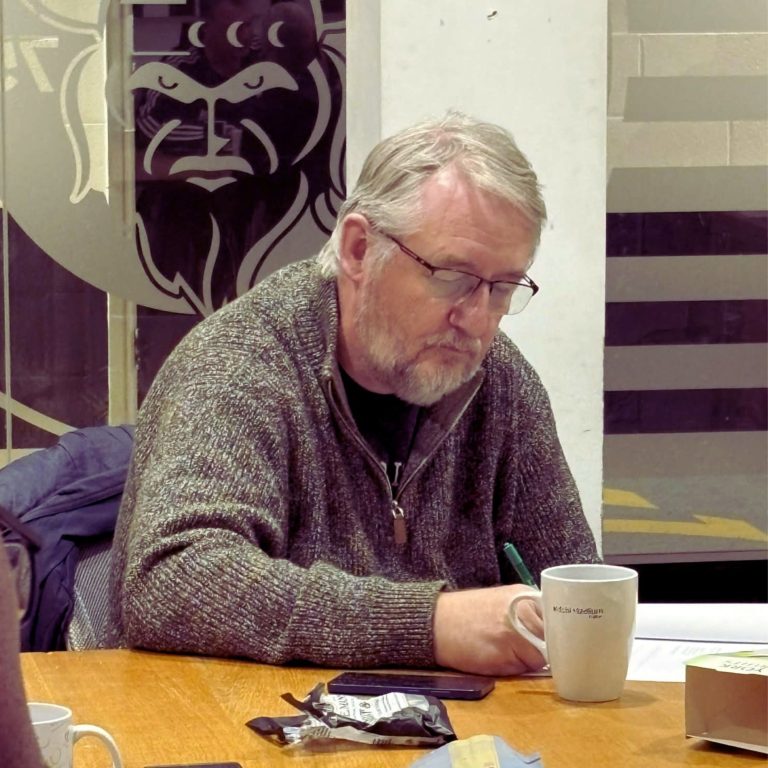 Participant engaging in trauma-informed mental fitness workshop at Widnes RL Extra Time session delivered by Fynix Project